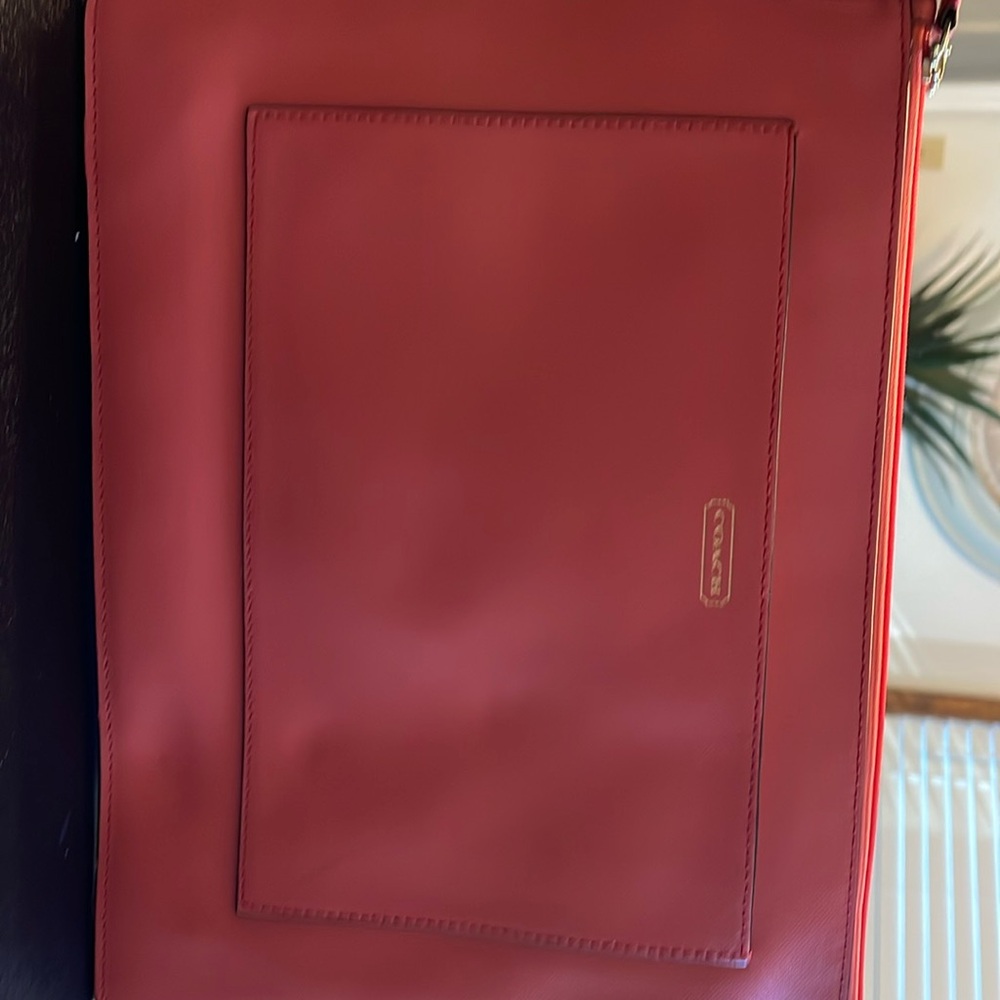 Brand new medium Coach clutch
